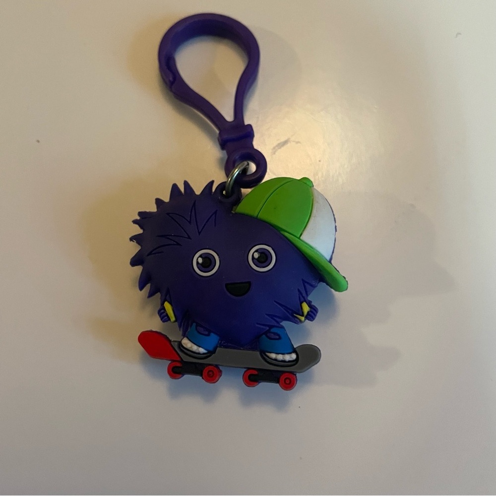 Purple Heart Skateboarder Keychain with Green Cap bag tag